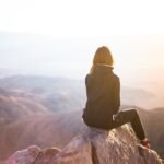 people, nature, woman, travel, adventure, trek, mountain, rock, sunset, cliff, black, hoodie, jacket, alone, thinking, freedom